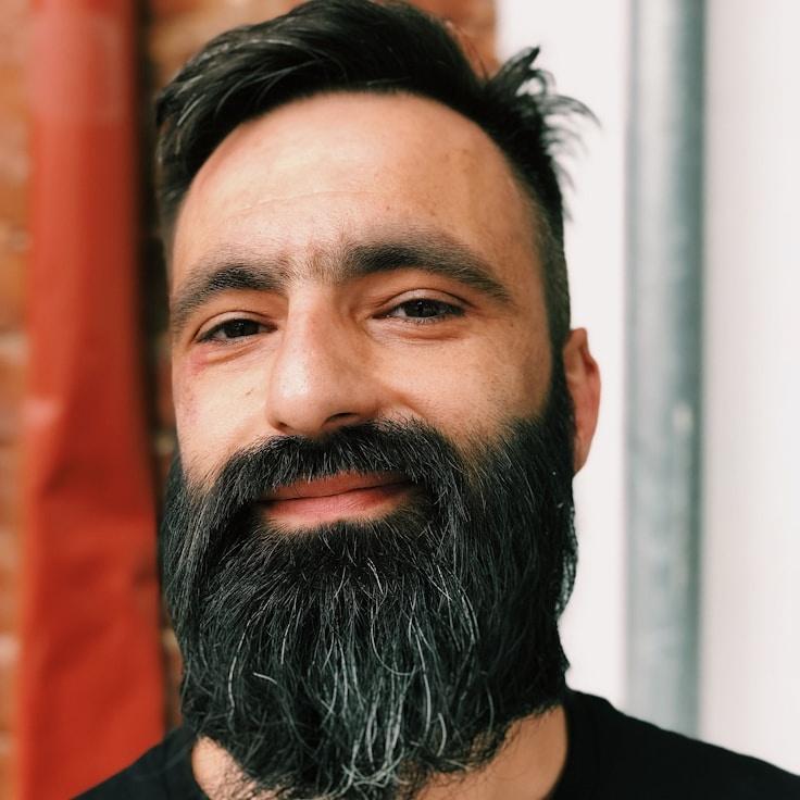 Portrait of Alex Rivers, community mentor and Italian cuisine specialist